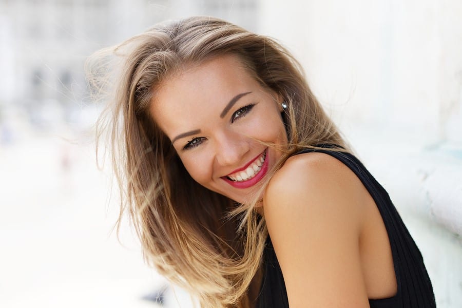 woman enjoying invisalign in Liverpool